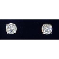Pair of 18ct gold round brilliant cut diamond ear studs stamped 750, 4.29 carat with European diamond certificate