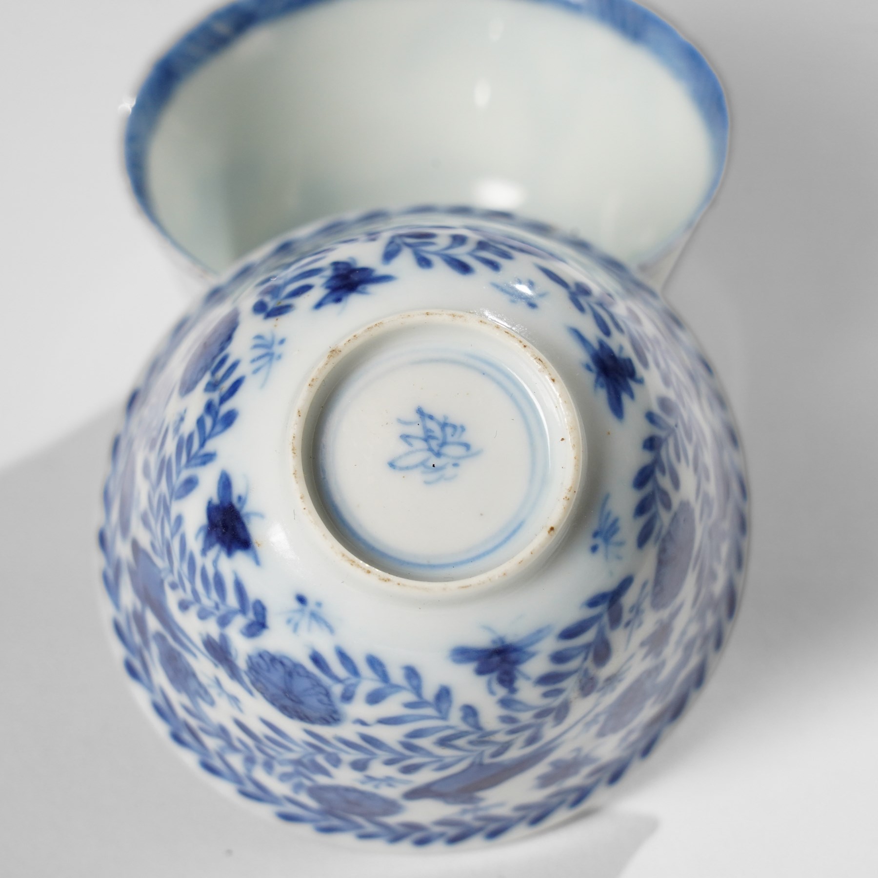 Collection of 18th century blue and white Chinese tea wares, comprising girl on swing saucer and tea bowl, boy riding buffalo tea bowl, one wine cup with foliate rim with Artemisia leaf mark to base, and similar with lotus mark to base, miniature vase, small teabowl with six character reign mark possibly Chenghua, Daoguang saucer, and others, mostly unmarked (13)
