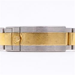 Rolex Oyster Perpetual Submariner Date gentleman's stainless steel and gold automatic wristwatch, Ref. 116613LN, serial No. 8201P7C5, back dial with luminous hour markers, unidirectional rotating black ceramic bezel, on stainless steel and yellow gold Rolex Oyster bracelet with fold-over clasp, boxed with guarantee card dated 2013