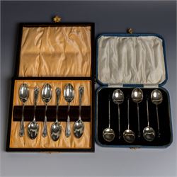 Two sets of early 20th century cased silver coffee spoons, comprising a set of six with sc...