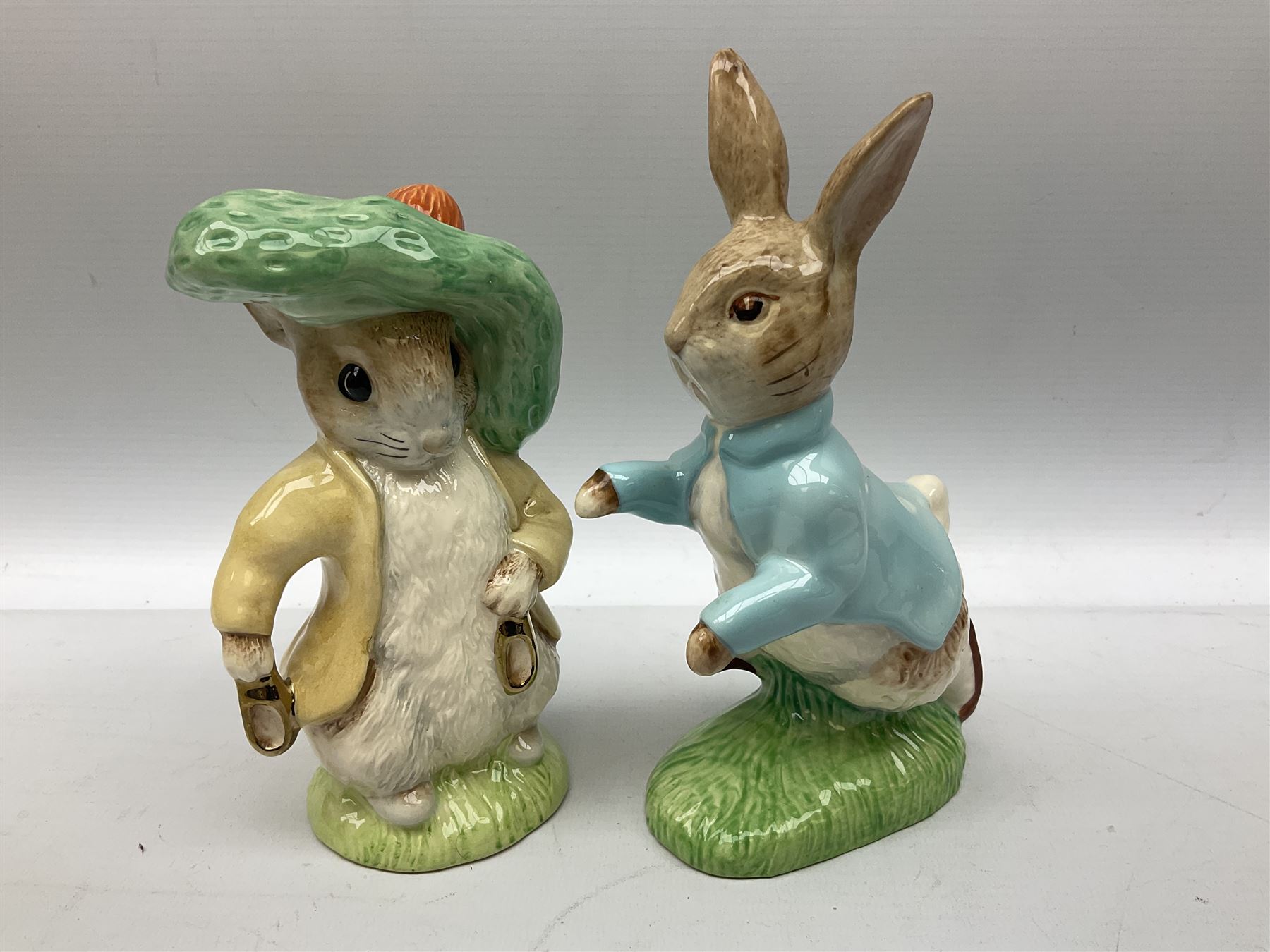 Collection of Beswick figures to include Beatrix Potter Squirrel Nutkin, Jemima Puddleduck, Spike and Tyke, Tom and Jerry, both boxed and with certificates, Chamois 1551 and Babycham 1615a (a/f) Beswick Ware Royal Douton Peter Rabbit and Benjamin Bunny, with certificate
(9)
