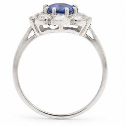 Platinum sapphire an diamond cluster ring, single modified cushion cut sapphire of approx 1.40 carat, surrounded by milgrain set round brilliant cut diamonds and baguette diamond shoulders, hallmarked, total diamond weight approx 0.80 carat