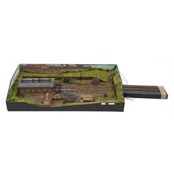 '00' gauge - table top model railway layout with multiple tracks around a central engine shed with other buildings and figures, diorama on three raised sides and open tunnel to one end for further extension, wired for electricity, main layout 104 x 52cm