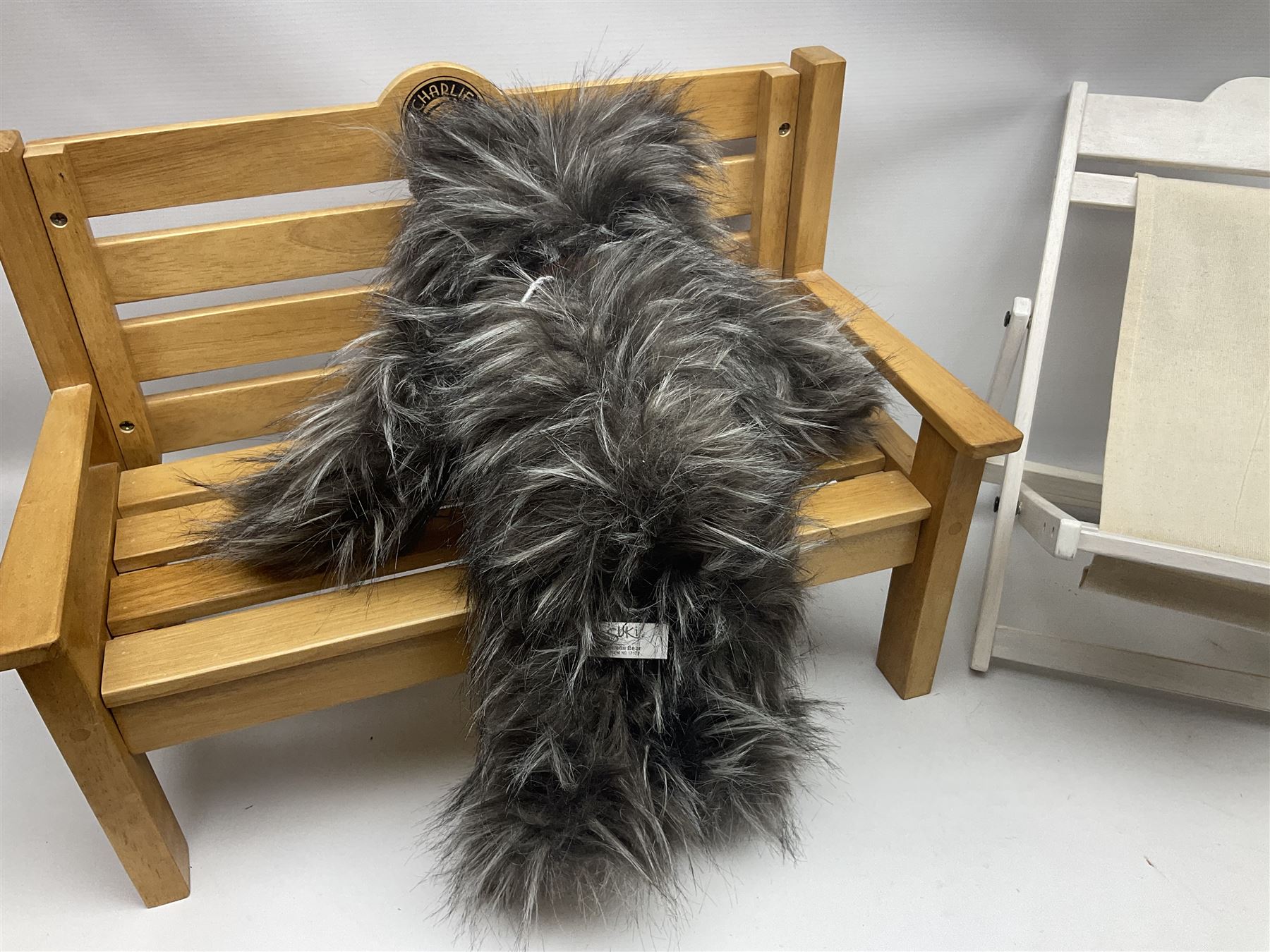 Charlie Bears bench, H41.5cm L58.5cm D29.5cm, and two Charlie Bears deck chairs, each approximately H37cm, together with a limited edition Silver Tag Bear, Logan Bear, 226/1,500, with tag, and two further bears, (6)