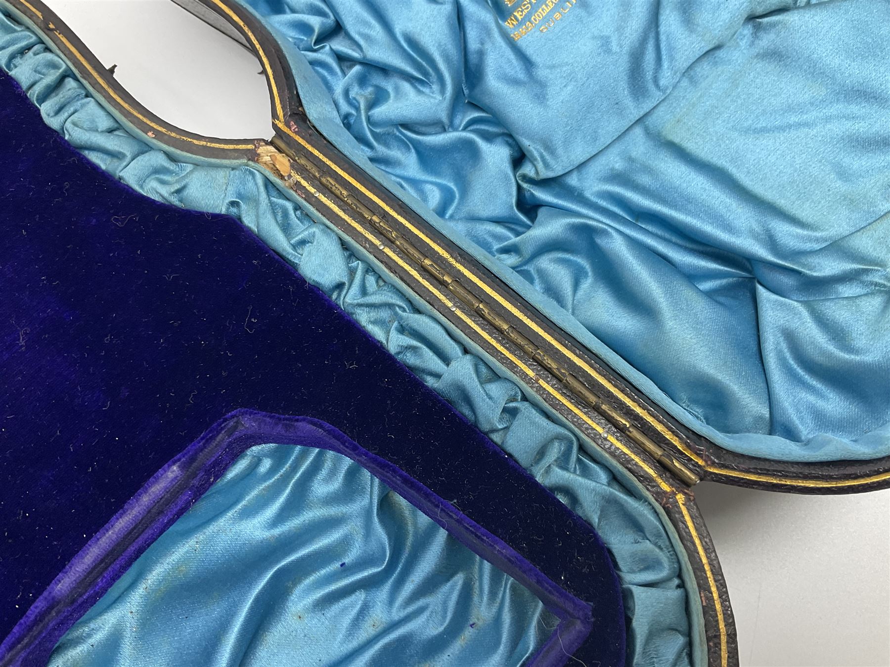 Victorian three-piece silver tea service, comprising teapot, twin handled open sucrier and milk jug, of oval form with shaped rim and C handles, each engraved with crests and bands of strapwork decoration, the milk jug and sucrier with gilt interiors, hallmarked Josiah Williams & Co, Exeter 1881, the teapot with ivory insulators and finial, all contained with a tooled leather, blue silk and velvet lined fitted case, retailed by West & Sun, Dublin 
This item has been registered for sale under Section 10 of the APHA Ivory Act