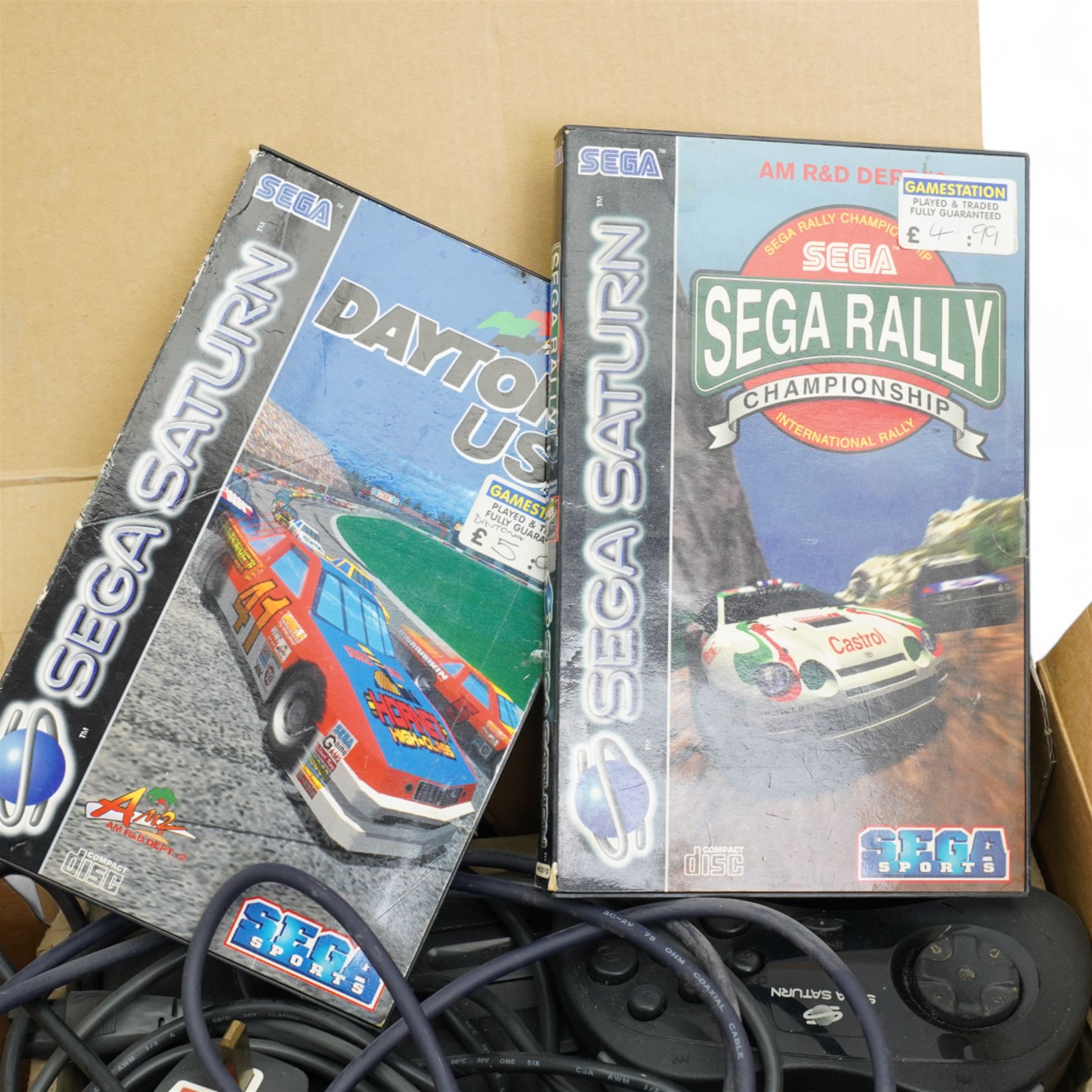 Sega Saturn games console, boxed with two games 'Daytona USA' and 'Sega Rally Championships'