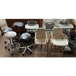 Set of three plastic and a pair of wooden baby high chairs with additional saddle stools (9)- LOT SUBJECT TO VAT ON THE HAMMER PRICE - To be collected by appointment from The Ambassador Hotel, 36-38 Esplanade, Scarborough YO11 2AY. ALL GOODS MUST BE REMOVED BY WEDNESDAY 15TH JUNE.