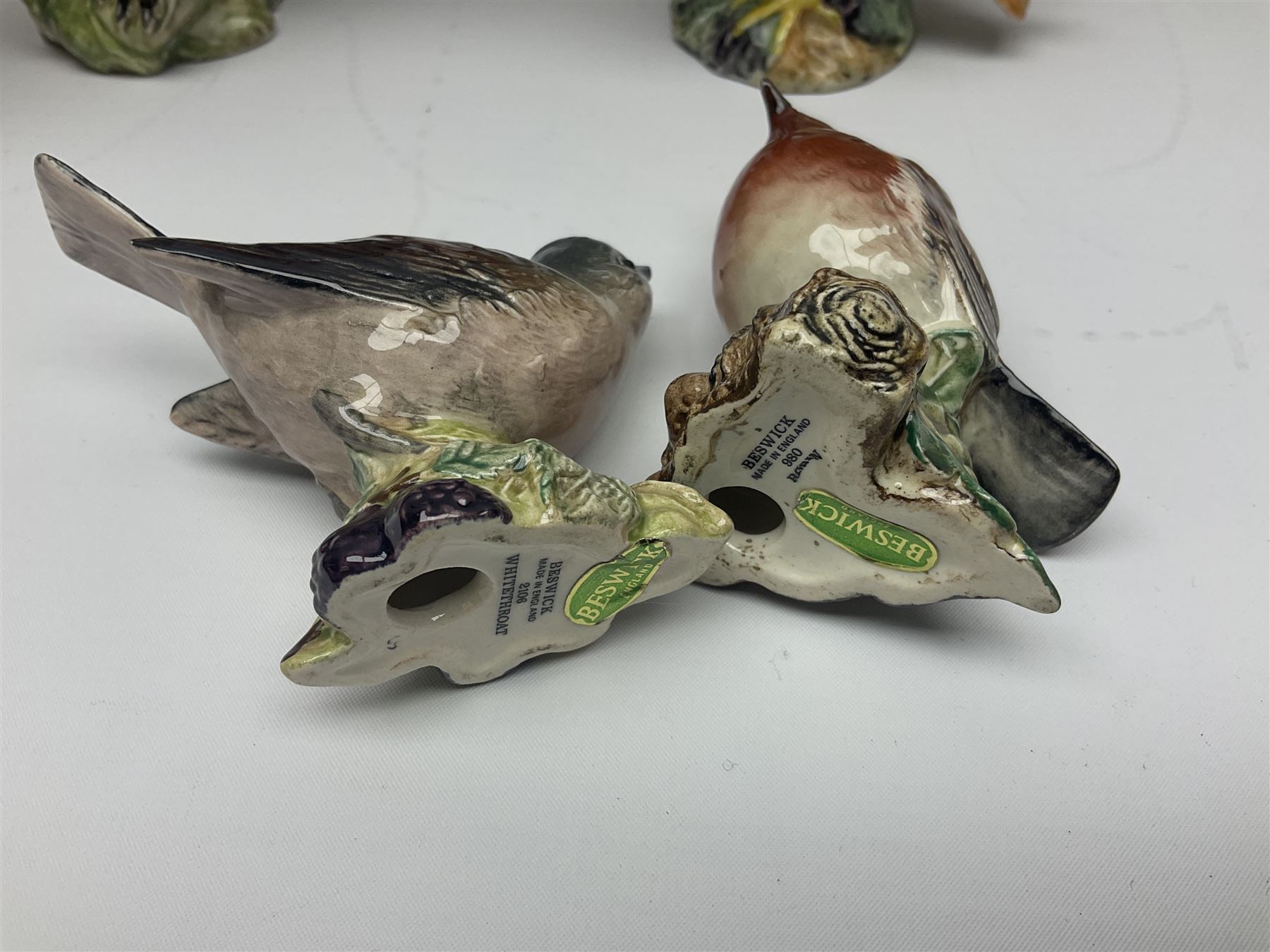 Collection twenty one of Beswick bird figures, to include Lapwing no 2416, Kingfisher no 2671, Red Pigeon 1383, Cuckoo no 2315, Nuthatch no 2418 etc