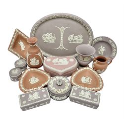  Collection of Wedgwood Jasperware, in orange, lilac and pink colourways, including oval tray, small jug, trinket boxes, trinket dishes, etc , all with impressed mark beneath