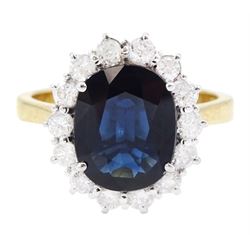 18ct gold oval cut sapphire and round brilliant cut diamond cluster ring, sapphire approx 3.30 carat, total diamond weight approx 0.85 carat