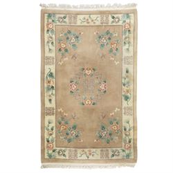Chinese wool rug, beige ground decorated with peonies, flowering branches and butterflies,...