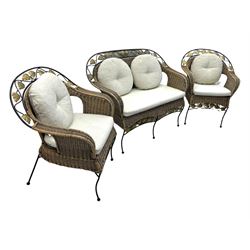 Late 20th century three-piece garden suite, wicker construction and wrought iron frame, decorated with cast metal leaf motifs, cream seat cushions and round back cushions