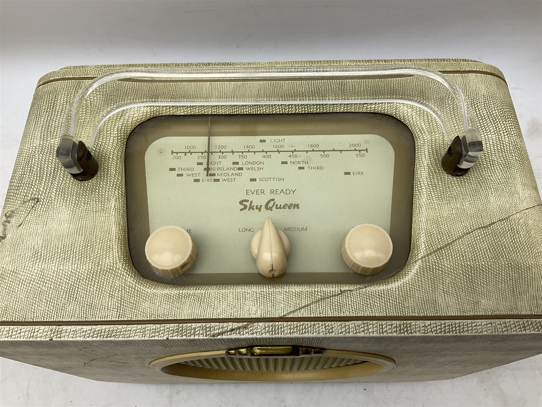 1950s Pye Type P43 cabinet radio in cream Bakelite case with orange knobs, W30cm H22cm D16cm, together with Ever Ready Sky Queen portable radio, Ekco portable radio in red case, Boxed Bush Special Edition 2002 Queens Golden Jubilee radio, Hacker Herald VHS radio (5)