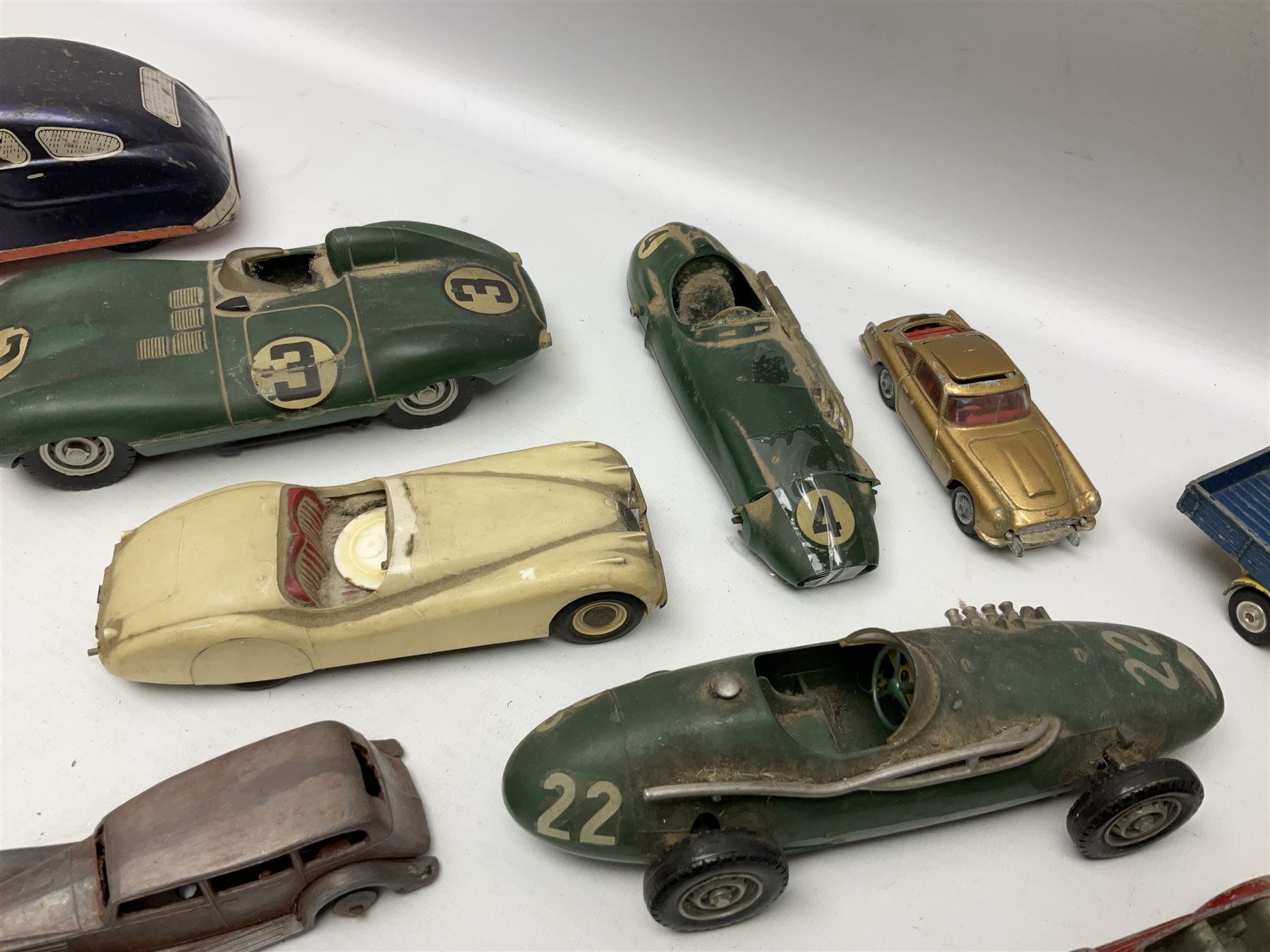 Various Makers - fourteen unboxed and playworn die-cast models including Wee-Kin Sunbeam Talbot, Corgi James Bond Aston Martin and ERF lorry, Dinky Thunderbolt Racing Car, Cadillac Eldorado, Cunningham C5-R, Lagonda etc; Minic tin-plate police car and jeep; other tin-plate models; Merit Plastic racing cars and quantity of spare parts etc