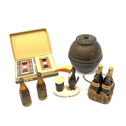A group of Guinness related items, comprising Carltonware toucan, H9cm, six miniature Guinness bottles, four in wicker carry basket, and cased Guinness playing cards, together with a Lipton's tea caddy, inscribed Lipton's Souvenir tea caddy, British Empire Exhibition 1924. 