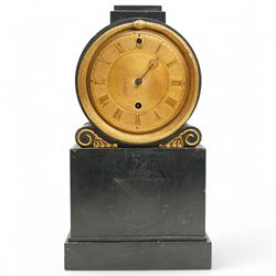 Benjamin Vulliamy of London- a small Regency 8-day ormolu and black marble mantle timepiece c1820, circular movement with a drum housing cradled on decorated scroll supports and a stepped marble plinth, the front of the plinth faintly incised with an armorial coat of arms, 3-1/2