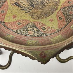 Indian brass pedestal dish, the dish engraved with peacock to centre, the stem modelled as a King Cobra, with engraved and enamelled decoration throughout, together with a similar pair of candlesticks, modelled as King Cobras, dish H23.5cm 