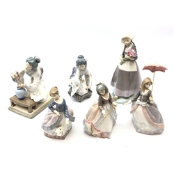  Six Lladro figures comprising 'Dutch Girl with Tulips' no. 5065, 'Angela' no. 5211, 'Jolie' no. 5210, 'Girl Decorating' no. 4840 and two others (6)  