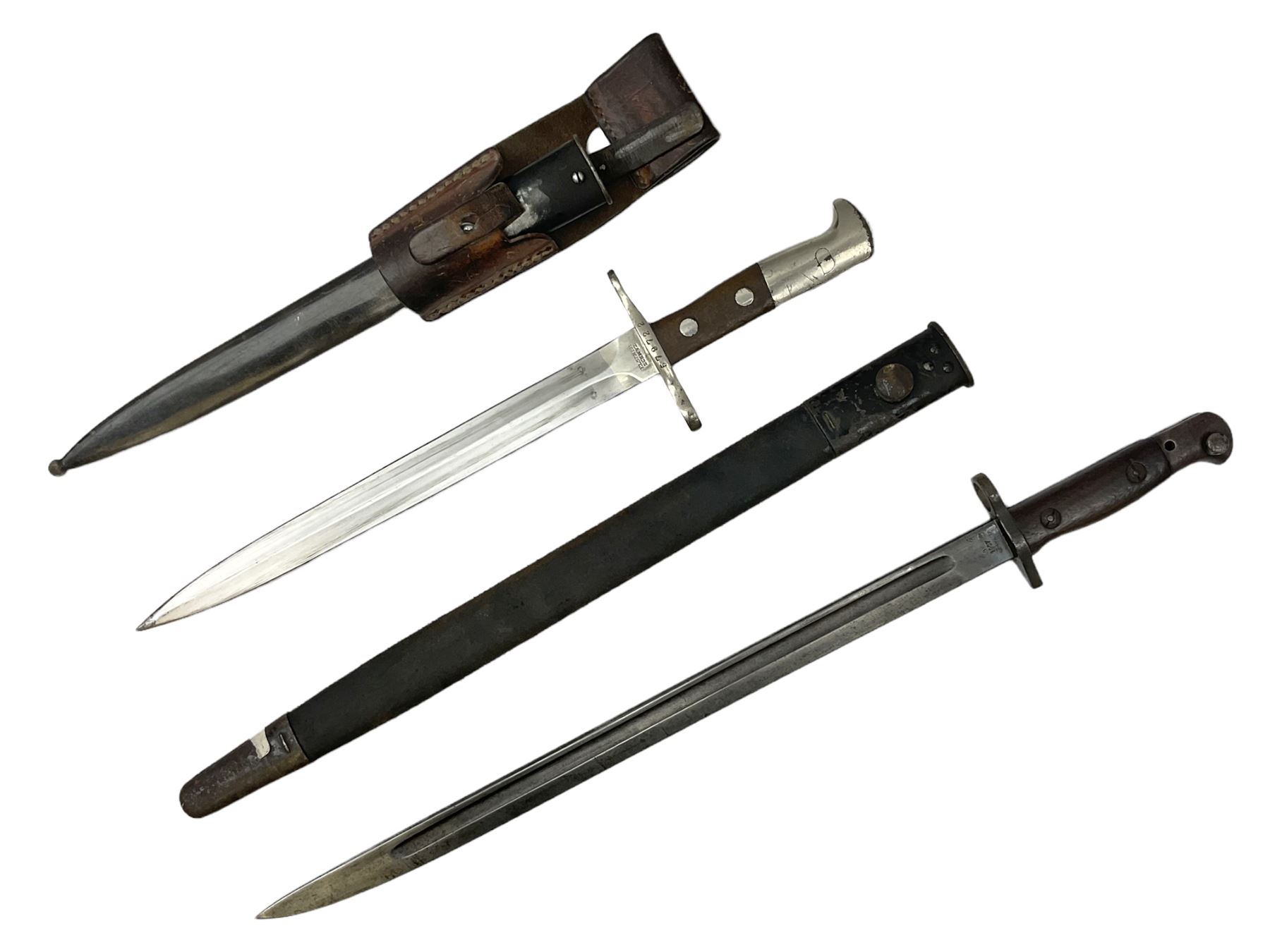 British Enfield 1907 model SMLE bayonet, with 43cm fullered steel blade and metal mounted leather scabbard L58cm overall; and Schmidt-Rubin Model 1918 bayonet the 30cm steel blade marked Elsener Schwyz No.579722; in steel scabbard with leather frog marked G. Bertolini Sellaio Vira/G.Tic 79 L45cm overall (2)