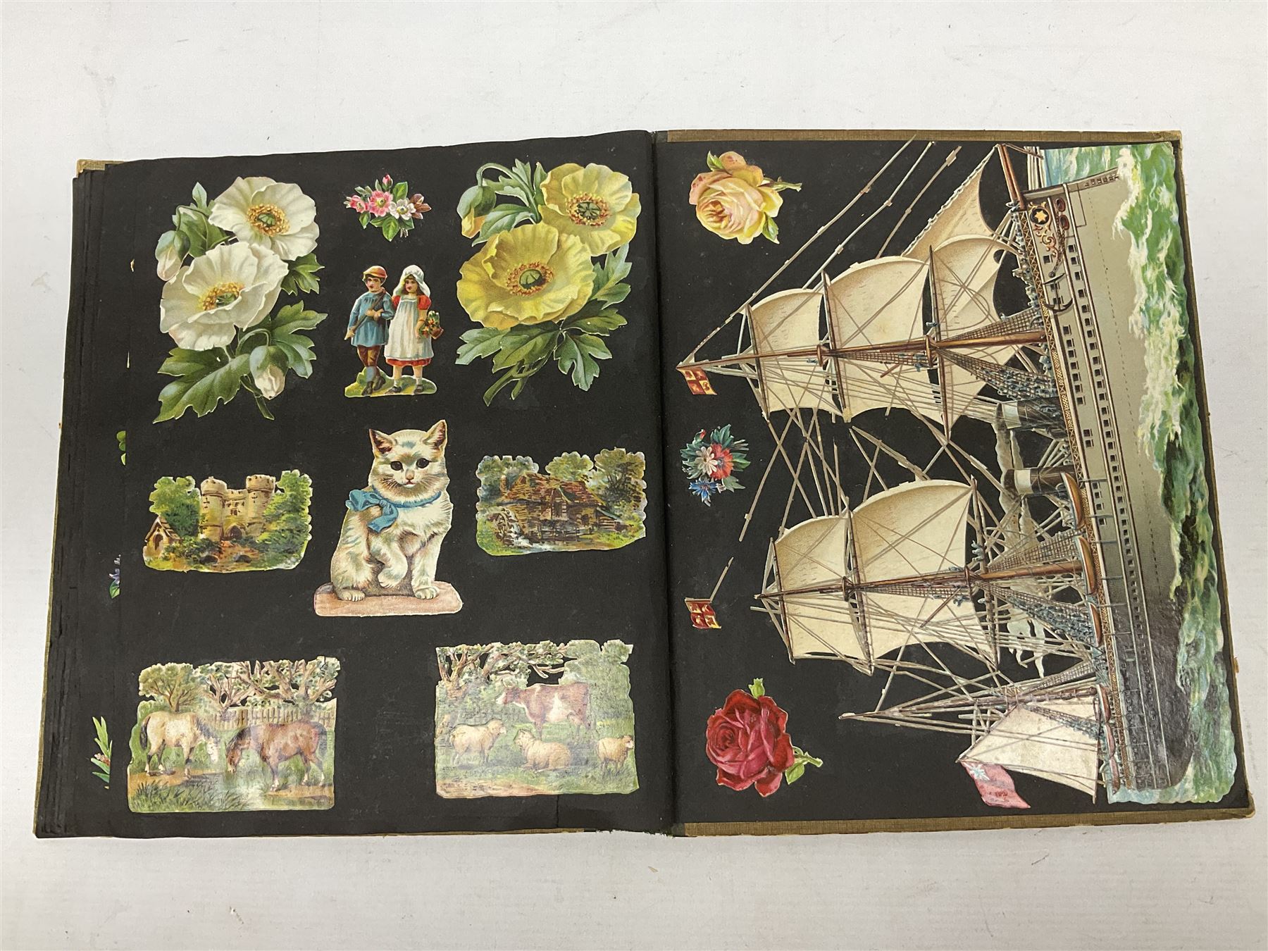 Victorian scrapbook containing twenty-six double sided pages and two fixed end pages of various fixed decoupage to include clippings of maritime interest, greeting cards, portraiture, flowers, animals etc, 