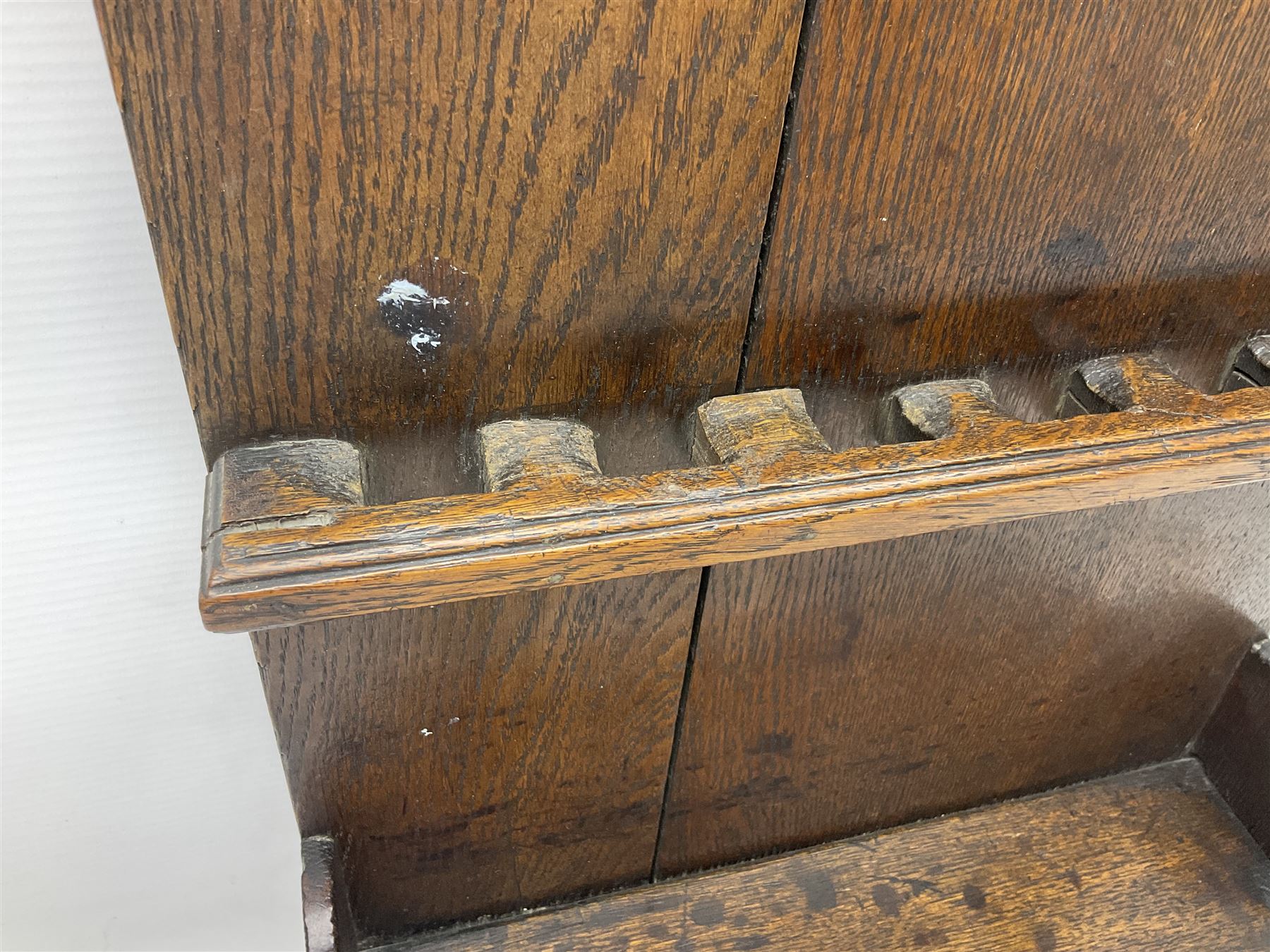 George III oak spoon rack and candle box, the rectangular backplate with shaped  pediment and two six aperture spoon racks, above a candlebox with hinged cover, with various brass spoons and a pair of brass candle snuffers, H56.5cm, W35cm, D14cm 