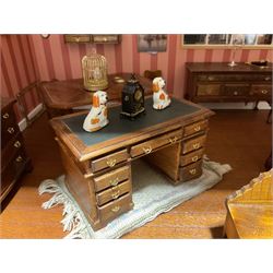 Good quality late 20th century dolls house by M. James dated 1995 in the form of a Beverley East Yorkshire Antique Shop called 'North Bar Antiques'; single-storey single-roomed shop with textured brick walls and flat roof, fully glazed hinged front with recessed hinged customer door and central window to the rear; comprehensively furnished with chests of drawers, pedestal desk, breakfast table, lowboy, two longcase clocks, delft rack with ceramics, occasional tables, pictures, Regency style mirror and collectibles; decorated walls with coving and picture rail and simulated floorboarding; wired for electric lighting; maker's plaque W61cm H42.5cm D41.5cm