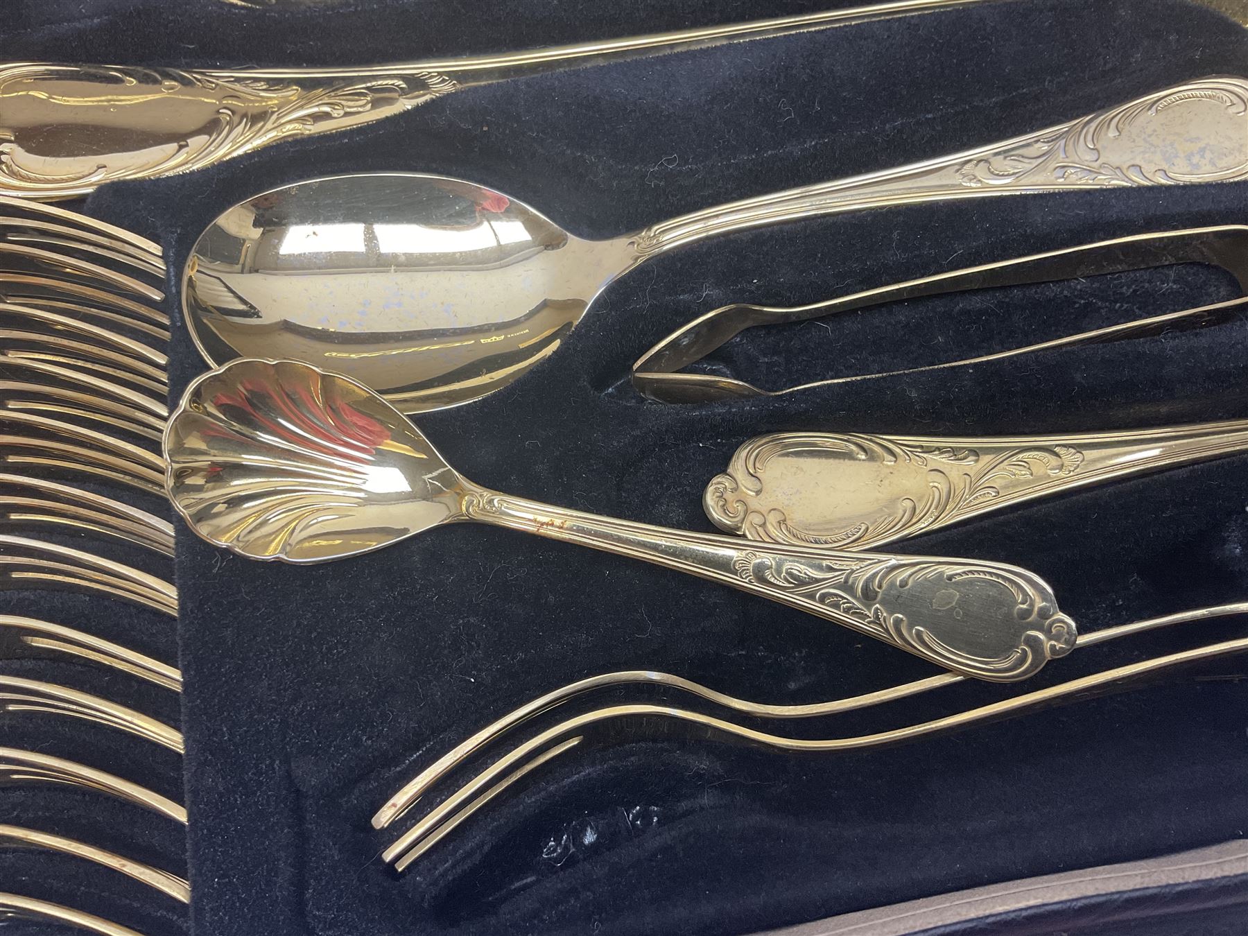 Bestecke Solingen canteen of gold plated cutlery for twelve place settings, including ladle, cake slice and serving spoons, contained within a briefcase, together with a matching set twelve of Bestecke Solingen gold plated fish knives and forks, in fitted case 
