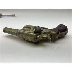 Early 20th century Flobert 5mm blank firing revolver with six-shot chamber, top venting, nickel plated with folding trigger No.118 L12.5cm overall; replica non-firing 'British Bulldog' revolver; and Windproof gas lighter inscribed 'Revolver-99 Spring and Autumn' in holster marked 'Star-Line'