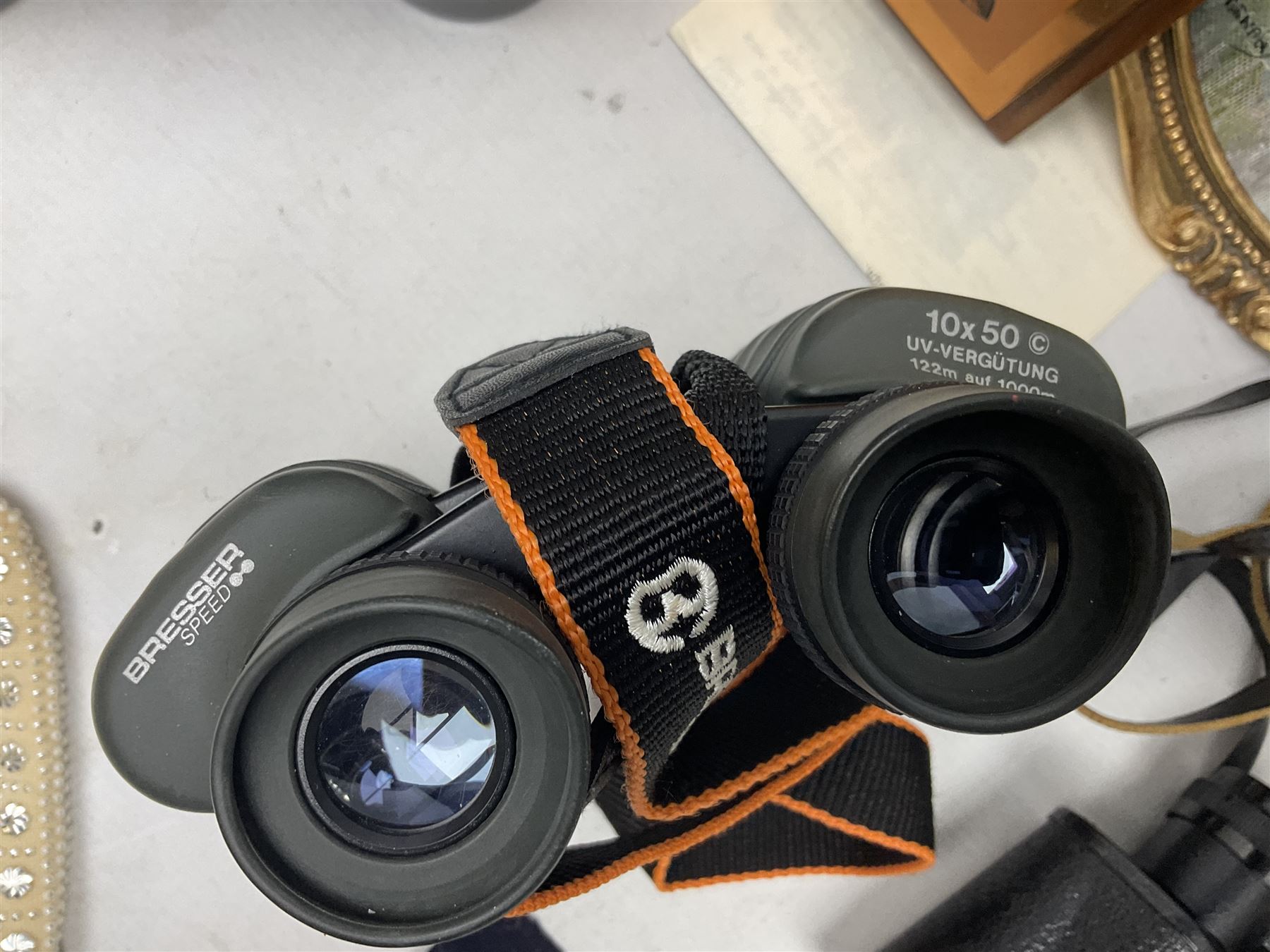 Three pairs of binoculars to include Enbeeco Concord and Bresser, Palestine police patch, framed pictures etc
