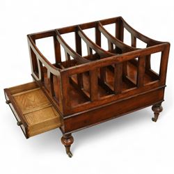 Late 20th century large mahogany canterbury, of rectangular form with four divided curved upper racks, single frieze drawer with brass knob handles, raised on turned legs with brass castors