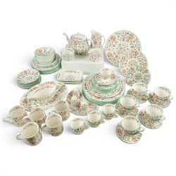 Minton Haddon Hall tea and dinner service, including teapot, milk jug, hot water jug, open sucrier, ten teacups and eight saucers, eight dinner plates, eight soup bowls, etc 