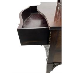 Early 20th century mahogany cabinet on stand, with pierced arched foliate pediment over blind-fretwork frieze, fitted with single astragal glazed door flanked by bevelled mirror back shelves with cluster column uprights, serpentine base fitted with two drawers with blind-fretwork facias 