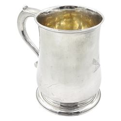 George II silver mug, of bellied form with capped scroll handle, the body engraved with a quiver of arrows, upon a circular stepped foot, hallmarked London 1740, makers mark indistinct, H11.5cm, approximate weight 10.22 ozt (318 grams)