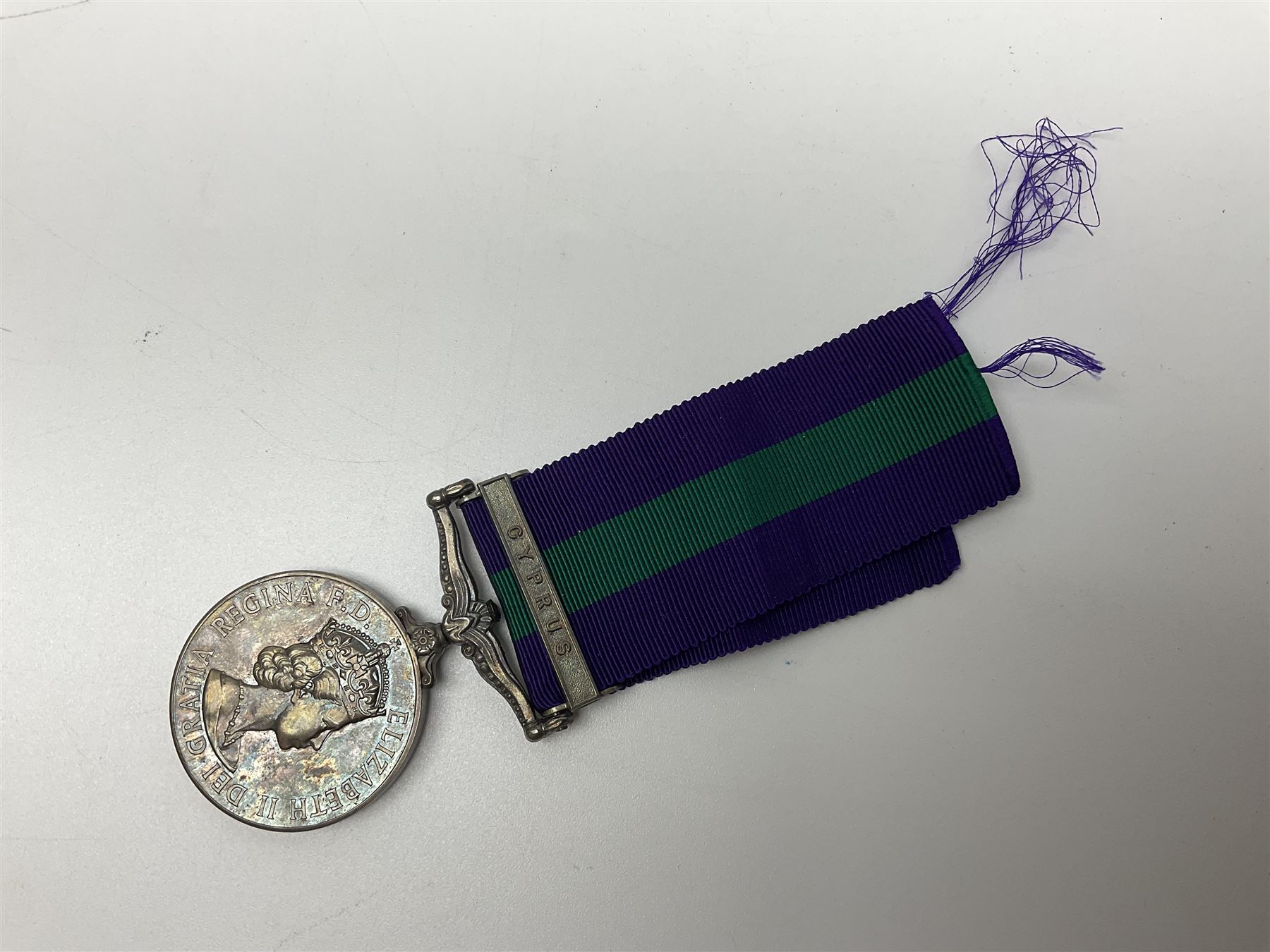 Collection of WW2 and police medals c.1933-1955, awarded to Eric Drinkwater comprising 1939-45 War Medal, Defence Medal, 1939-45 Star and Burma Star, on wearing bar; 1918-62 General Service Medal with Cyprus clasp to P.S. E.G. Drinkwater; boxed; Police Long Service and Good Conduct Medal to Const. Eric C. Drinkwater; cased; Royal Life Saving Society bronze medal to E.C. Drinkwater July 1933; boxed; and George V 1937 coronation medallion; boxed.