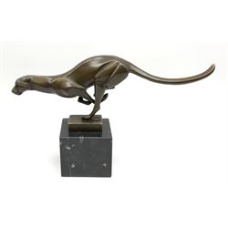 A bronze figure, modelled as a stylised running cheetah, with foundry mark, upon black marble base, overall H19cm. 