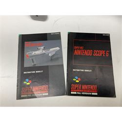 Two Super Nintendo Entertainment System (PAL) controllers, accessories and games. Super NES Game Commander with original box and instruction booklet, Super NES Nintendo Scope (1992) transmitter gun, receiver, Super NES Nintendo Scope 6 game with original instruction booklets. Further games to include ‘The Legend of Zelda a Link to the Past’, ‘Super Mario World’, ‘Super Mario Kart’, ‘The Lawnmower Man’, and ‘Exhaust Heat’, all with original instruction booklets. ‘PowerMonger’ and Disney’s ‘Aladdin’ game cartridges only 