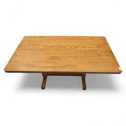Treske of Thirsk - solid oak refectory dining suite, rectangular top with chamfered edge over trestle base united by a central stretcher, together with six matching slat back dining chairs, including two carvers, with panelled seats and square legs united by stretchers (H 87cm, W 62cm, D 57cm)