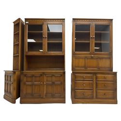 Ercol - mid-20th century dark elm 'Old Colonial' three sectional wall display unit, comprising two units and corner unit, fitted with open shelves, glazed cupboards and drawers
