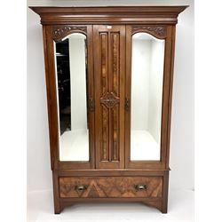 Late Victorian double walnut wardrobe, projecting cornice, two bevel edge mirror doors above single drawer, shaped solid end supports