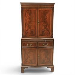 Georgian design mahogany cocktail drinks cabinet, bow fronted with mirrored and maple interior, slide out mirrored serving area, over two drawers and a cabinet below, raised on bracket feet