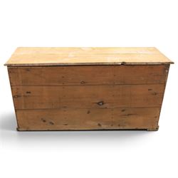 Victorian stripped pine sideboard, rectangular plank top rounded edges, with central cupboard door with shaped panel, flanked by two banks of three graduating drawers with turned knobs, raised on a plinth base 