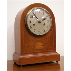  Edwardian arched top inlaid mahogany mantel clock with silvered Arabic dial, twin train movement striking the hours on a gong, H31cm  