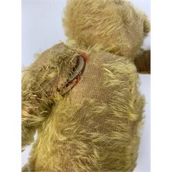 Early 20th century cinnamon coloured bear c1920, possibly continental, with unusual hedgehog styled head/face, swivel jointed head, wood wool filled body with jointed limbs, five claw stitches to feet  and inoperative growler mechanism H16