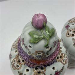 Pair of pot pourri vases and covers, decorated with floral sprigs and with rose finials to the covers, H24cm