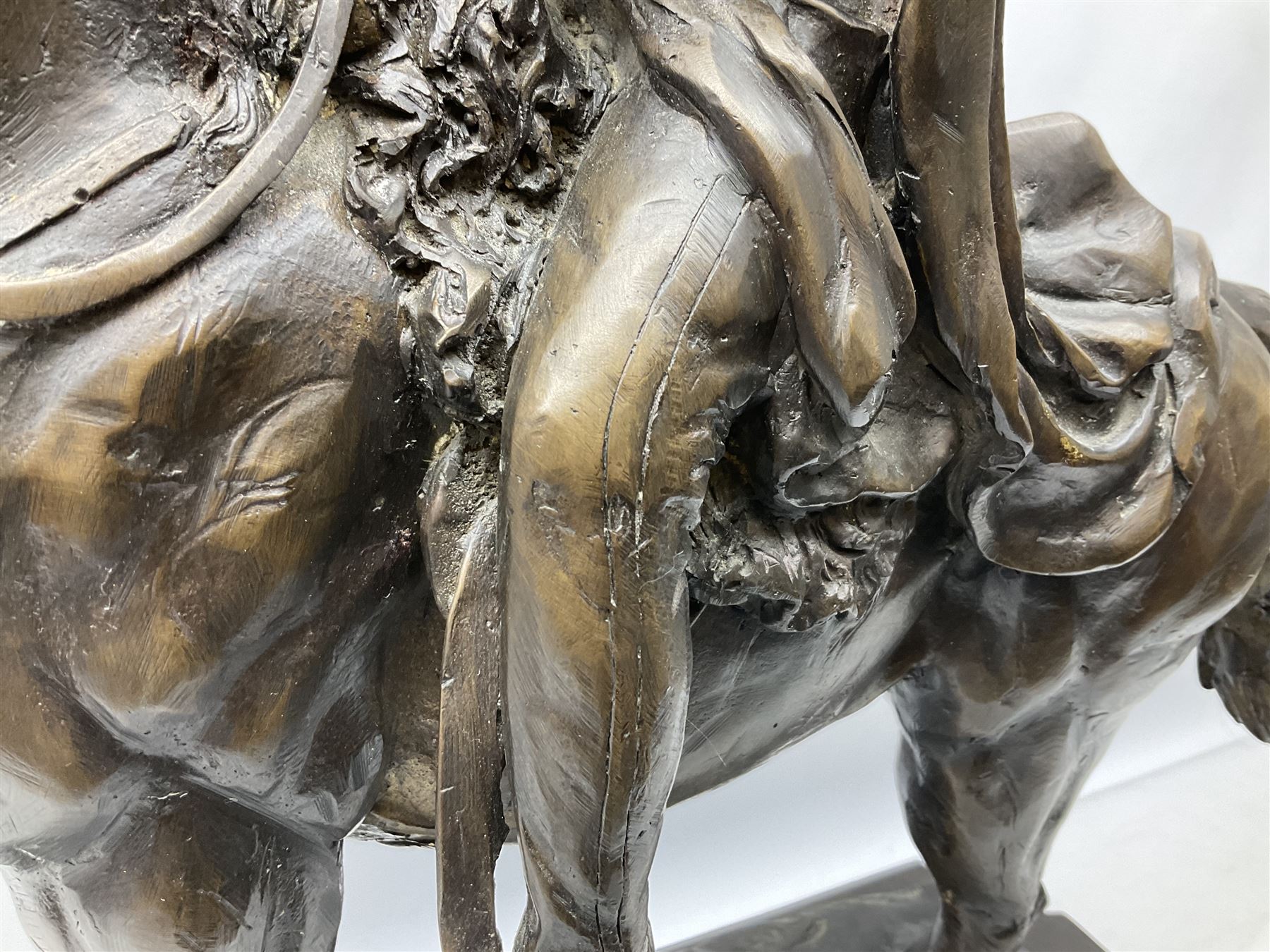 Large and impressive bronze figure of Wellington seated on a horse, on a sarcophogus shaped stepped base impressed 'Meunier Paris', the canted corners inset with battle trophies H68cm L50cm D22cm