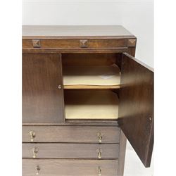 Early 20th century oak tallboy chest, double cupboard doors enclosing interior, above three long graduating drawers, raised on cabriole supports 