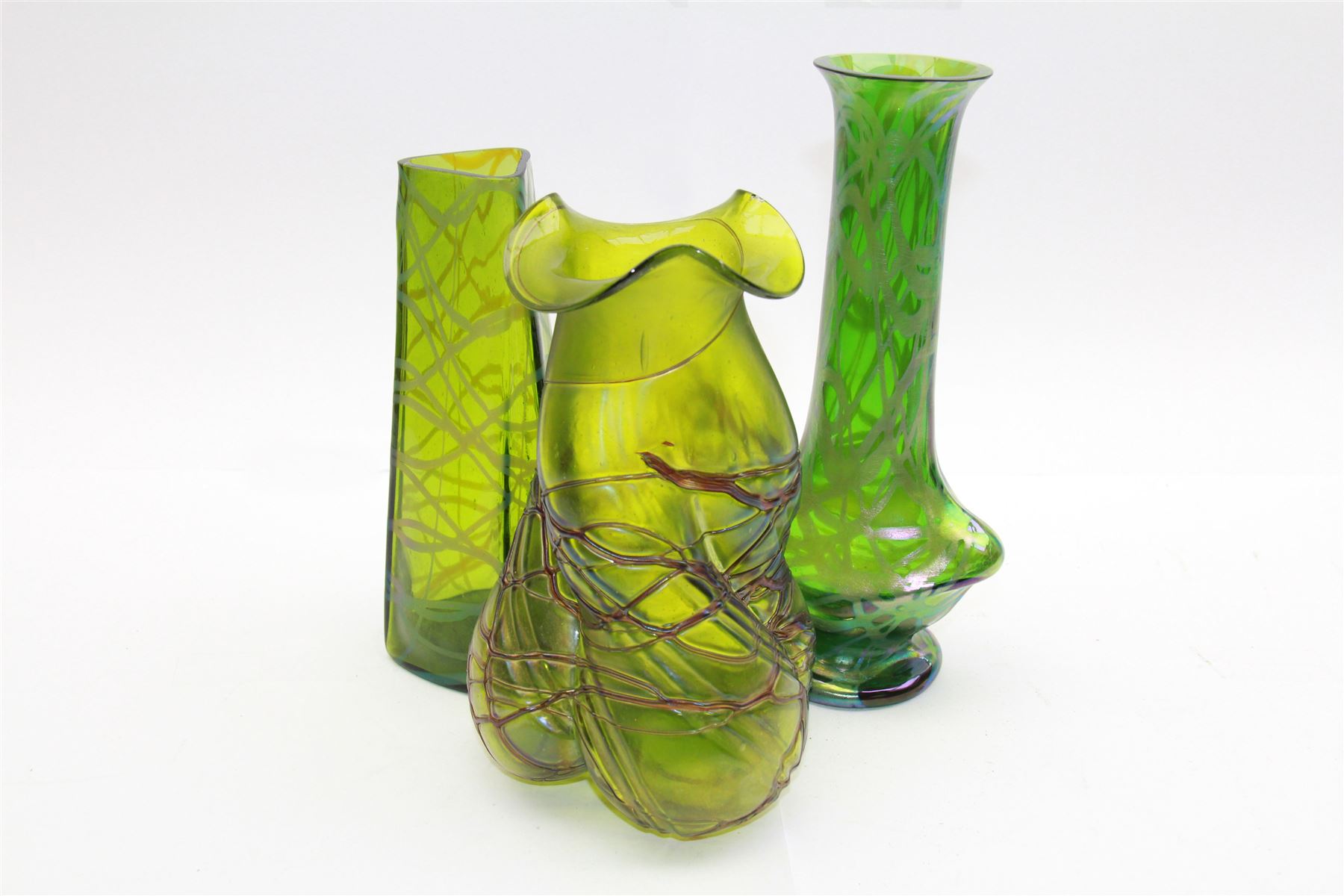 Three Austrian Art Nouveau green iridescent glass vases, to include two Pallme-Konig examples and a Kralik example, each with threaded vein decoration, tallest H25cm (3)