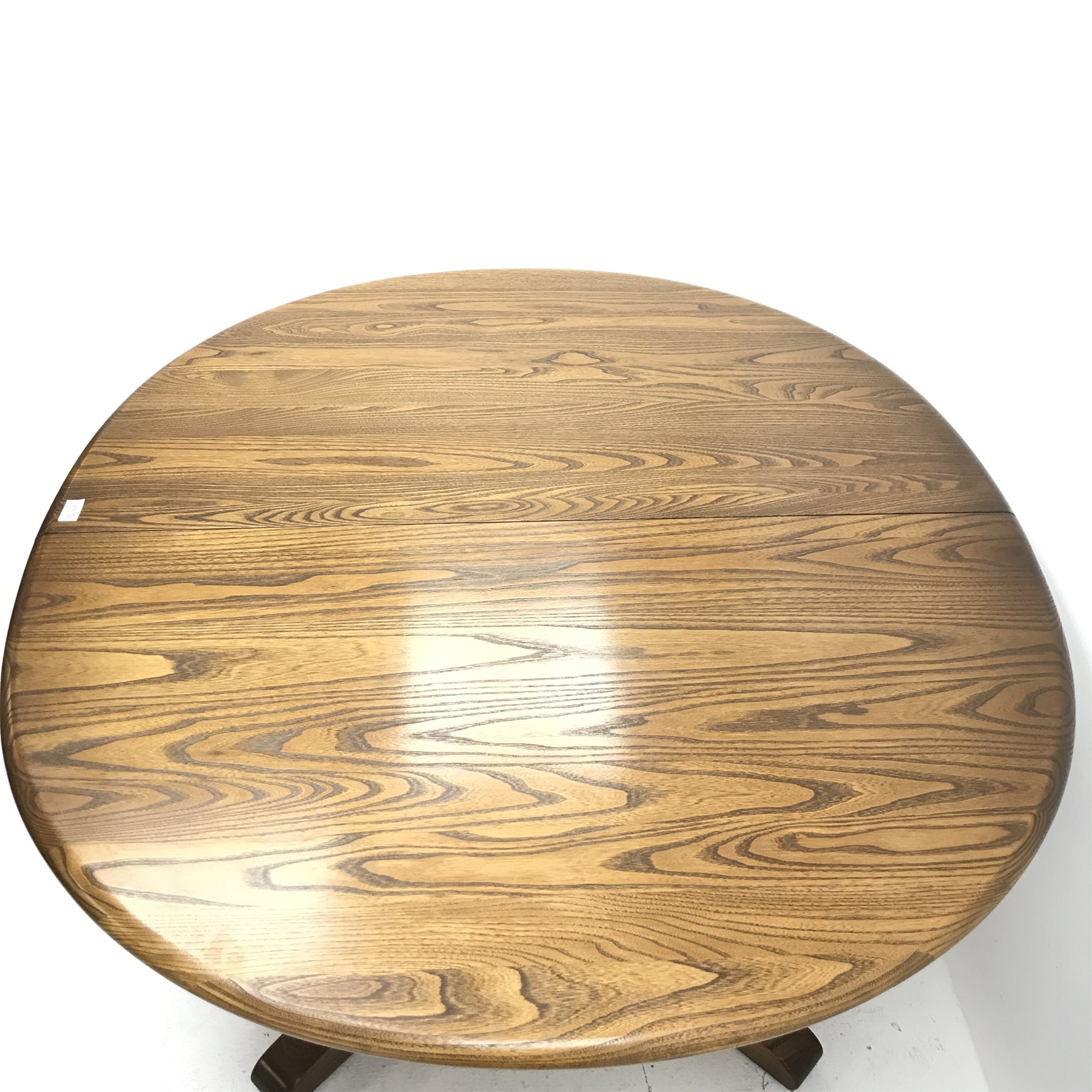 Ercol elm Old Colonial extending pedestal dining table with single leaf (W115cm and 165cm, H73cm, D115cm) and set six hoop back dining chairs (W43cm) 