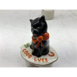 Five crested ware Good Luck black cats, comprising two Willow Art examples, two Arcadian examples and one Carlton China, to include Bridlington, Hull, Filey, etc, tallest H9cm
