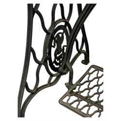 Singer - early 20th century cast iron treadle sewing machine, with hand crank wheel and oak work surface, the machine decorated with gilt foliate detail, complete with rectangular wooden cover and folding extension leaf